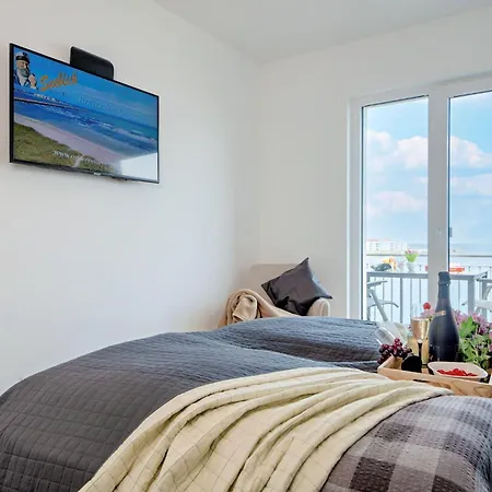 Fewo-kleine-auszeit-by-seeblick-ferien-oro-direkter-wasserblick-am-strand Apartmán